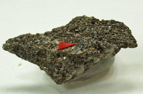 Melanotekite