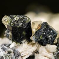 Magnesio-hornblende Calcite Magnetite Fluorapatite & Albite