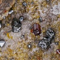 Rhönite Pseudobrookite Hematite & Forsterite